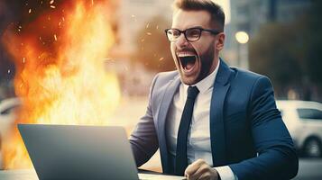 Young businessman in a successful suit shouts with joy Receive notifications from your laptop photo