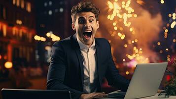 Young businessman in a successful suit shouts with joy Receive notifications from your laptop photo