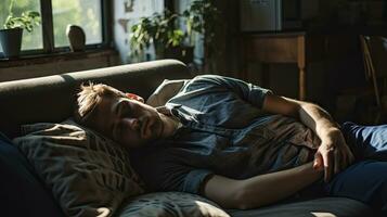 Young man sleeping on sofa at home photo