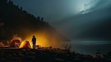 Night camping on the banks of male and female hikers There is thick fog along the river. photo