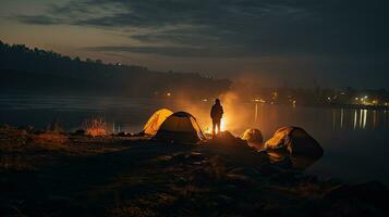 Night camping on the banks of male and female hikers There is thick fog along the river. photo