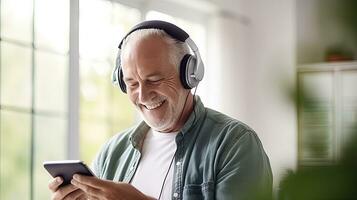Senior man wearing headphones making a video call on a tablet photo