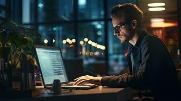 Young male software developer writes a program while working in the office. photo