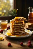 breakfast pancakes on plate with honey and berries photo