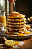 breakfast pancakes on plate with honey and berries photo