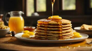 breakfast pancakes on plate with honey and berries photo