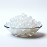 Jelly beads small pile translucent milky white on bowl generative AI photo