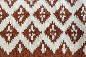 closeup of Wool sweater texture of light brown dark brown colors generative AI photo