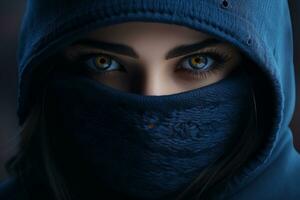 a woman in a hoodie with blue eyes photo