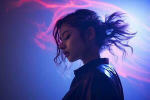 a woman in a black leather jacket standing in front of a neon light photo