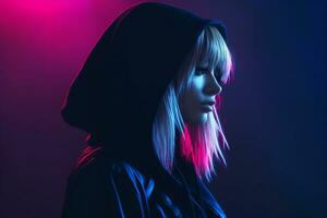 a woman wearing a hoodie in front of neon lights photo