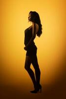 silueta de un mujer en un negro vestir en pie en frente de un amarillo antecedentes generativo ai foto