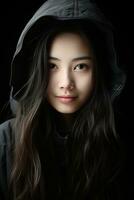 un asiático mujer en un negro capucha generativo ai foto