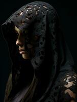 a woman in a black hooded robe photo