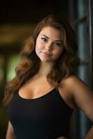 a woman in a black tank top posing for the camera photo