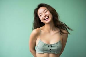 beautiful asian woman smiling and posing in a green bra top generative ai photo