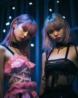 two asian women dressed in gothic clothing standing next to each other photo