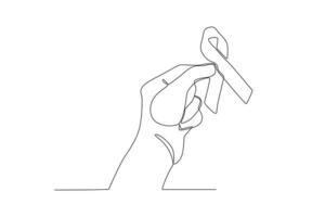 A hand holds the ribbon of World AIDS Day vector