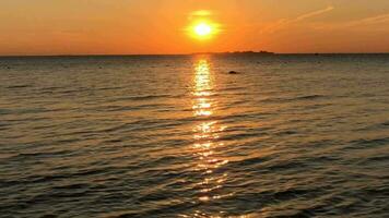 sun sets over the sea, sunny path, evening landscape, panorama up video