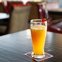 un vaso de naranja jugo en el mesa - ai generativo foto