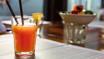 un vaso de naranja jugo en el mesa - ai generativo foto