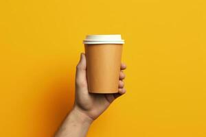 Hand holding coffee cup, yellow background. Generative AI photo