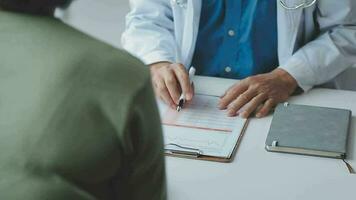 Female doctor in white coat holding hand of senior patient, giving help, comfort, psychological support, empathy at appointment. Elderly medic care, geriatric healthcare concept. Close up video