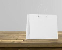 Empty shopping bags on wooden floor for advertising photo