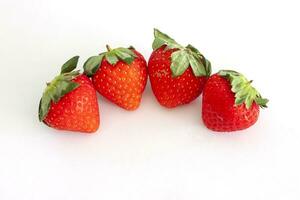 Fresh strawberry fruit isolated on white paper background. photo