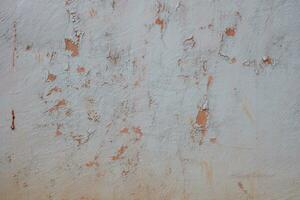 Background wall texture is damaged with the wall paint peeling off photo