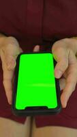 verde pantalla teléfono, utilizando móvil teléfono video
