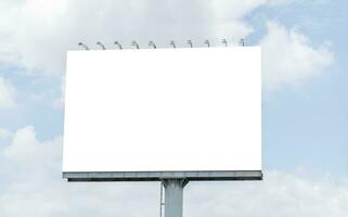 Pole outdoor billboard with blue sky background. Clipping path for mockup white screen photo