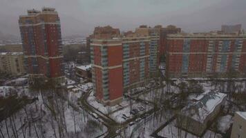 Flying over residential area in winter Moscow, Russia video