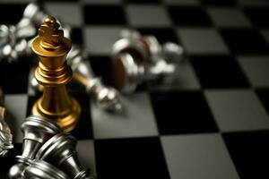 Golden King chess is last standing in the chess board, Concept of successful business leadership photo