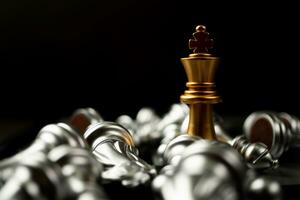 Golden King chess is last standing in the chess board, Concept of successful business leadership photo