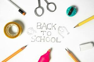 Back to school concept with stationery on white background, top view photo