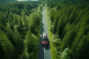 Aerial view of green forest and red car on the road. Bird's eye. generative ai. photo