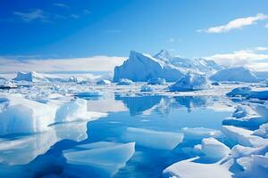 Crystal icebergs mirrored in serene Antarctic waters under a clear sky photo