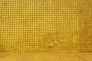 Wall and floors with gold tiles photo