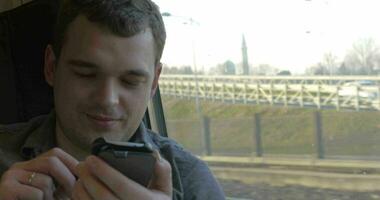 Man chatting on the mobile during train ride video