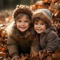 Adorable children playing in piles of autumn leaves photo