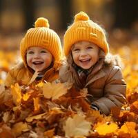 Adorable children playing in piles of autumn leaves photo