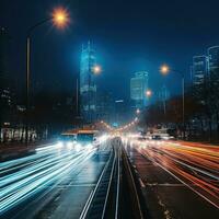 Busy night traffic on illuminated city roads photo