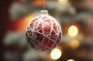 Red ball hanging from a Christmas tree, Christmas decoration, golden details. Generative AI photo