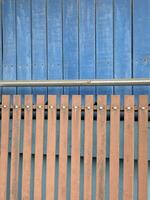 old metal fence with blue paint photo