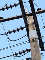 high voltage pole with blue sky background photo