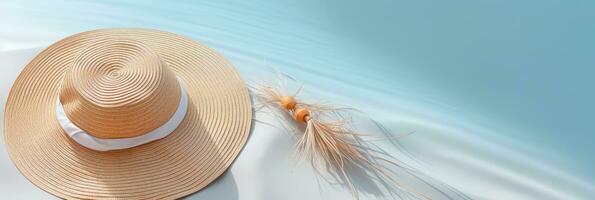 Summer background with straw hat and white sand with empty copy space photo