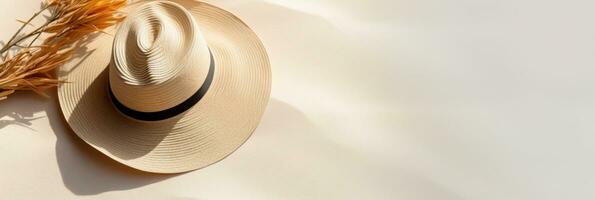 Summer background with straw hat and white sand with empty copy space photo