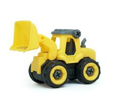 yellow plastic bulldozer toy isolated on white background. heavy construction vehicle toy. photo