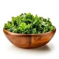 Chopped fresh kale salad in a wooden bowl isolated on a white background photo